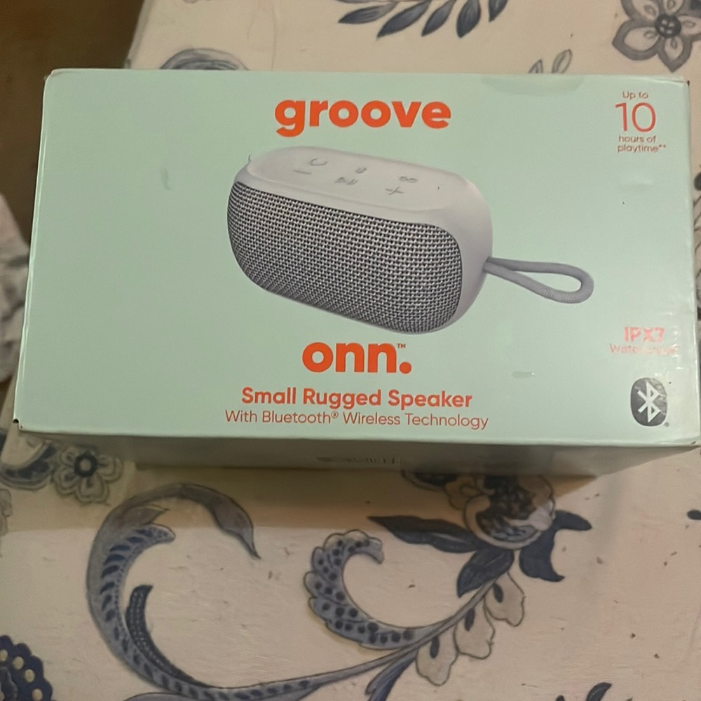 Gray waterproof Groove onn. Small rugged speaker